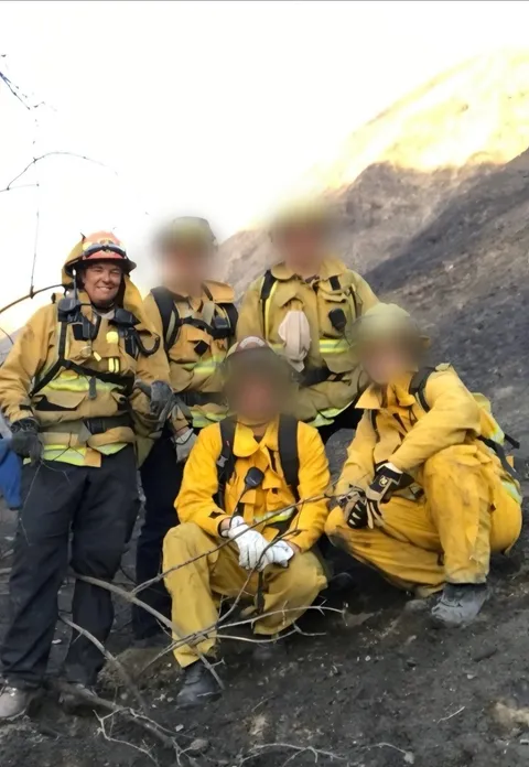 Wildfire hand crew posing together in the field